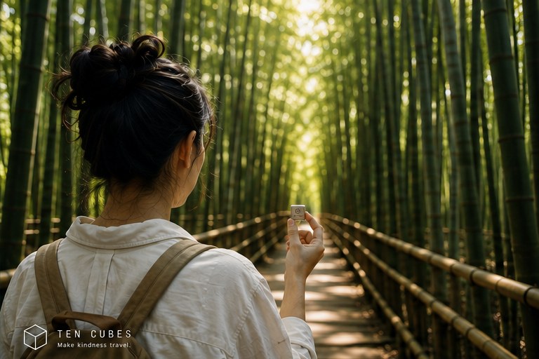 A woman holding a small metal cube on a path through a bamboo forest